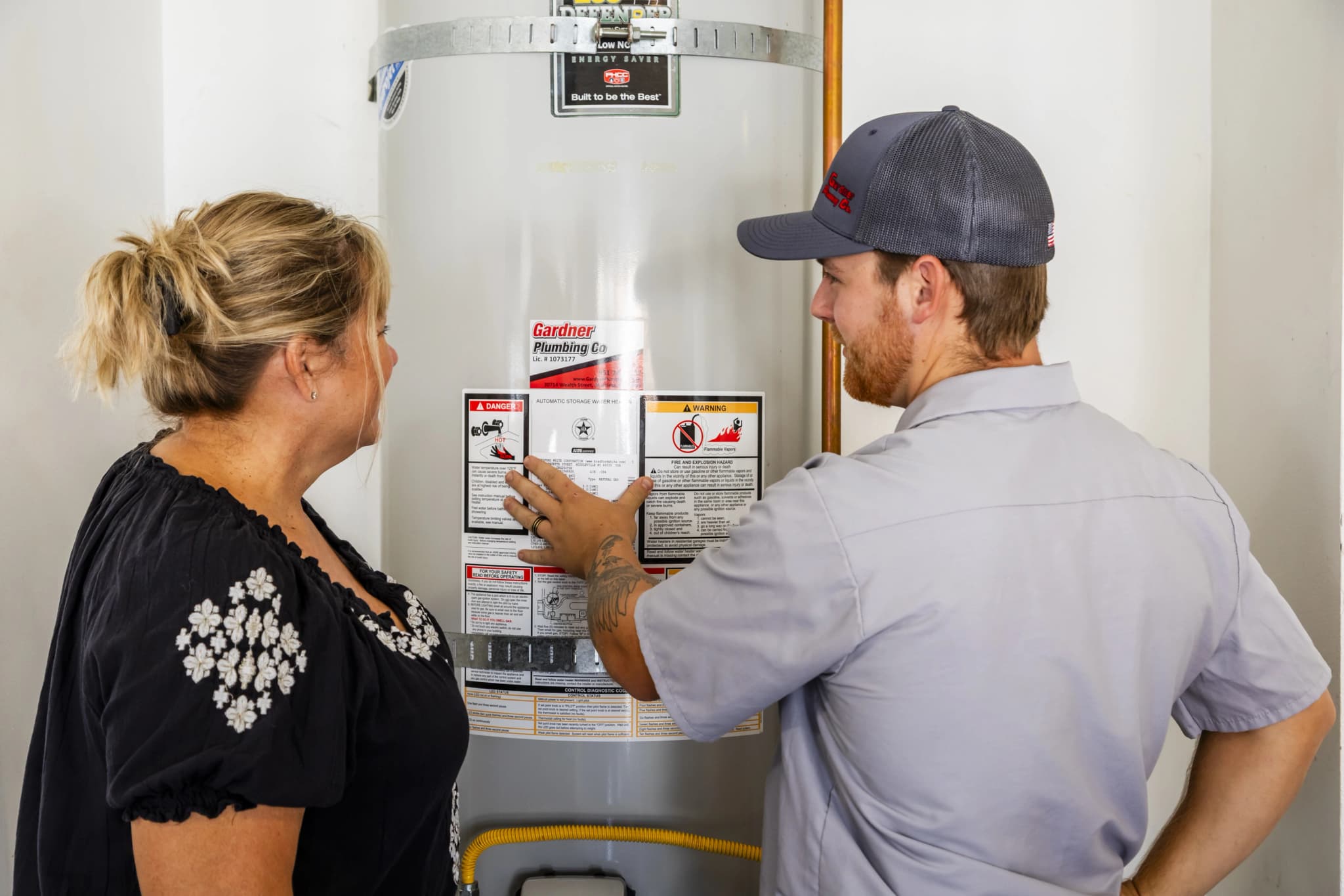 Professional plumber using hydro-jetting equipment to clean drains
